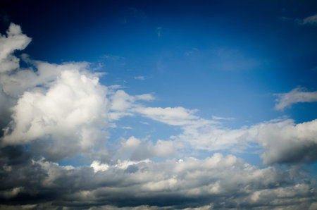 Dramatic sky. Saturated clouds before a thunderstorm, against the background of a blue sky.