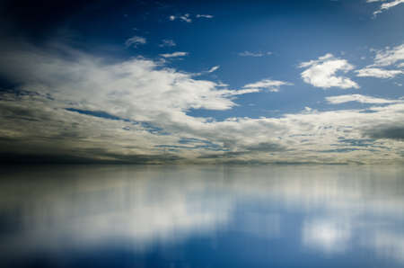 Blue sky.Clouds over seaの写真素材