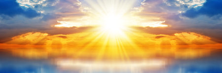 Colored Sunset. Panorama Sky with Clouds and Sun over Blue Sea