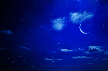 Night sky with clouds and moon. Universe filled with stars, nebula and galaxyの写真素材