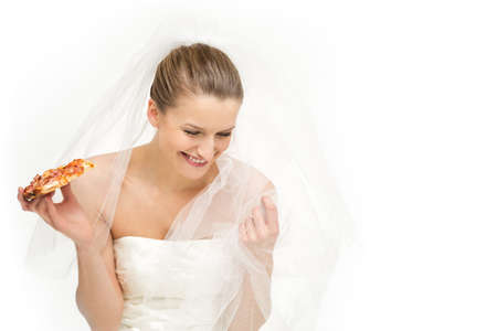 Tempting option for a bride - eat pizza or to look good on her special dayの写真素材