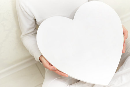 Valentines woman and heart symbol in hands - love