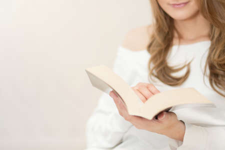 Woman reading book and relaxingの写真素材