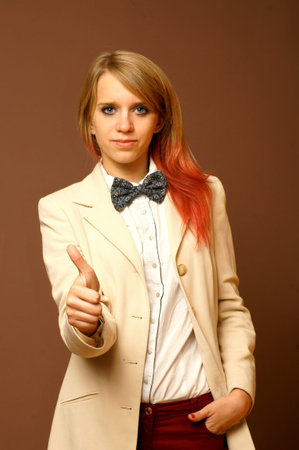 Young girl showing thumb