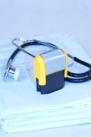  Stamp on documents and stethoscopeの写真素材