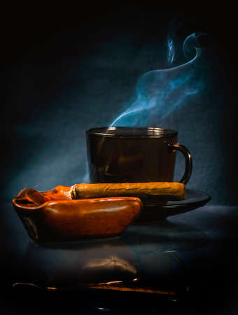 The cigar and hot drinkの写真素材
