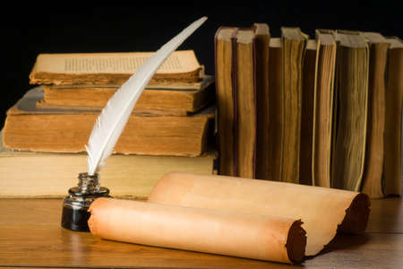Scroll of old paper for backgrounds old books, inkwell and penの写真素材