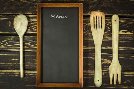 Wooden kitchen accessories and menu blackboardの写真素材