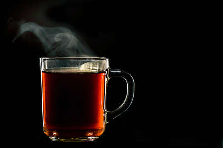 Hot tea on the black backgroundの写真素材