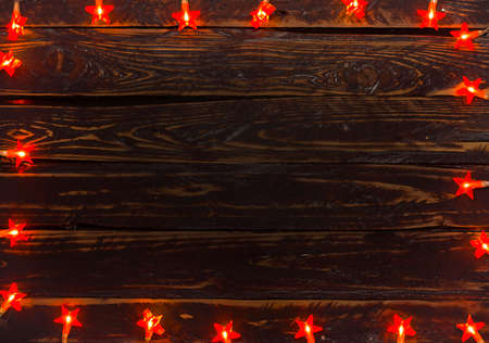 Background of old planks and Christmas lightsの写真素材