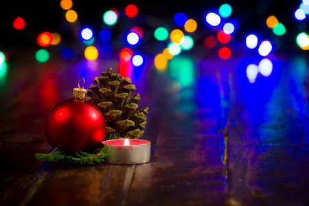 Concept of Christmas, candle with Christmas. Christmas bauble and the coneの写真素材