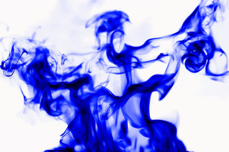 Blue smoke on white background, abstract background. Isolated.の写真素材