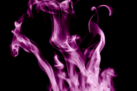 Purple smoke on a black background, abstract background. Isolated.の写真素材