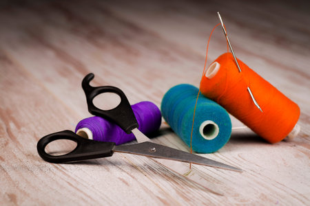 The concept of tailoring - thread reels, tailoring scissors