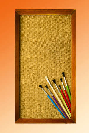 Concept of painting, colorful brushes on the background of the picture frameの写真素材