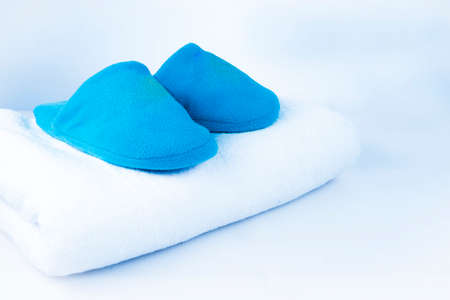 blue booties on a white towel on a white-blue backgroundの写真素材