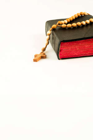Book with a rosary with space for text, isolated on a white backgroundの写真素材
