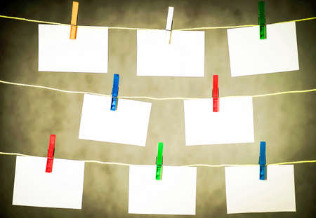 Cards hung on a rope with clipsの写真素材