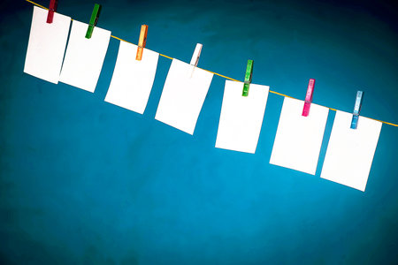 Blank cards - photos hung on a rope, fastened with clips