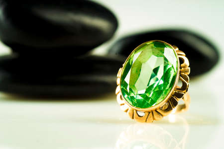 Gold ring with sapphire on black stonesの写真素材