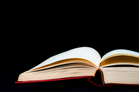 Open book on a black background