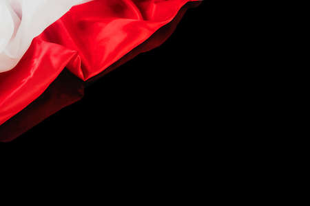 Polish flag on a black backgroundの写真素材