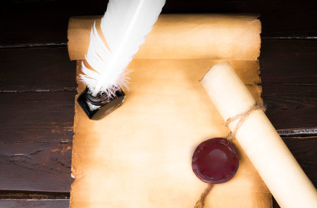 Scroll of parchment, and a pen and inkwellの写真素材