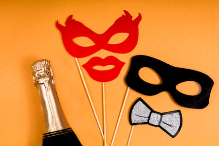 The concept of fun and carnival, masks held in handsの写真素材