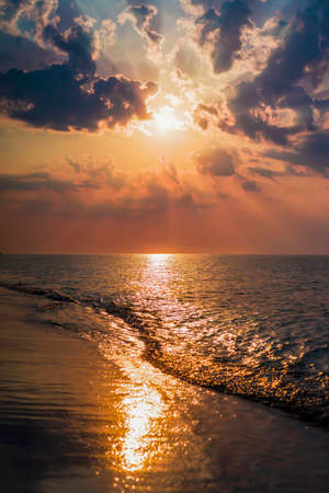 The concept of travel and rest at the seaside, sea waves on the background of the beachの写真素材