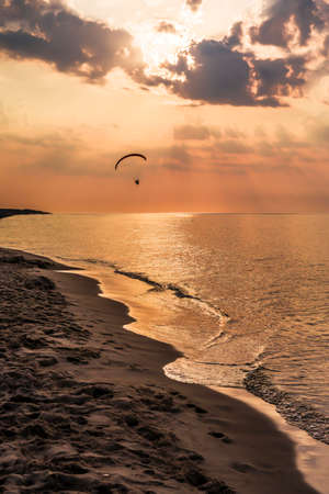 The concept of travel and rest at the seaside, sea waves on the background of the beachの写真素材