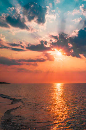 The concept of travel and rest at the seaside, sea waves on the background of the beachの写真素材