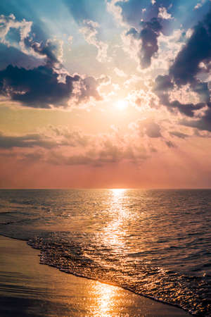The concept of travel and rest at the seaside, sea waves on the background of the beachの写真素材
