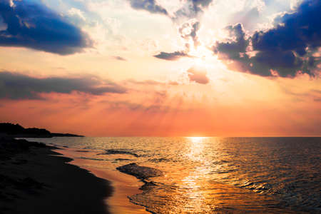 The concept of travel and rest at the seaside, sea waves on the background of the beachの写真素材