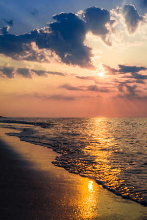 The concept of travel and rest at the seaside, sea waves on the background of the beachの写真素材