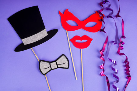 Carnival fun concept - Paper party props on purple backgroundの写真素材