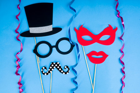 Carnival fun concept - Paper party props on blue backgroundの写真素材
