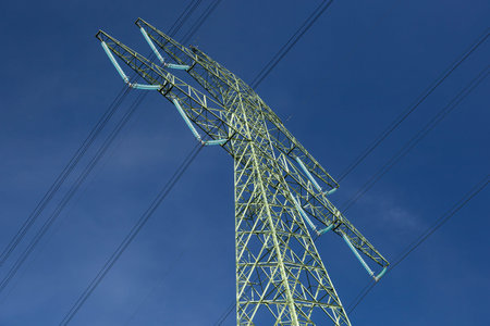 High voltage power pole against the sky