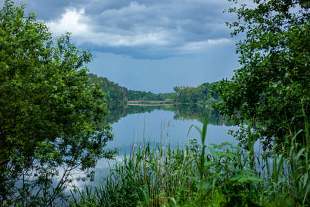 Olsztyn - bridge on Lake Dlugi - blue water, cloudy skyの写真素材