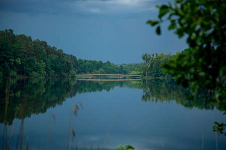 Olsztyn - bridge on Lake Dlugi - blue water, cloudy skyの写真素材
