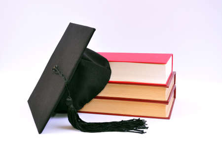 Student hat on books の写真素材