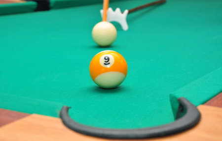 Billiard balls on a green billiard table
