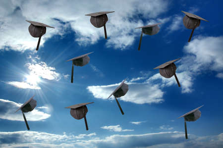 Student graduation hat over sunny skyの写真素材