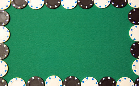 Green poker background with gambling chips all arround