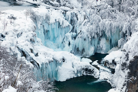 Frozen waterfalls during winter in Plitvice National Park, Croatiaの写真素材