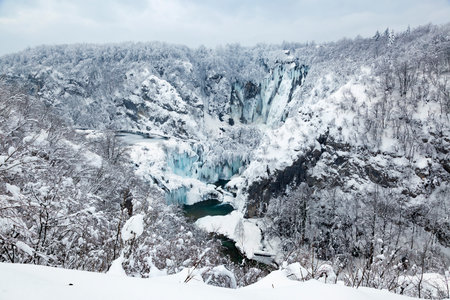 Frozen waterfalls during winter in Plitvice National Park, Croatiaの写真素材
