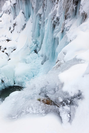 Frozen waterfalls during winter in Plitvice National Park, Croatiaの写真素材