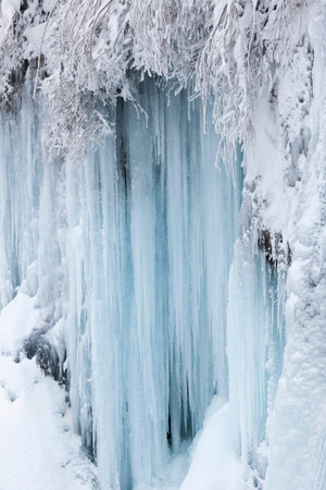 Frozen waterfalls during winter in Plitvice National Park, Croatiaの写真素材