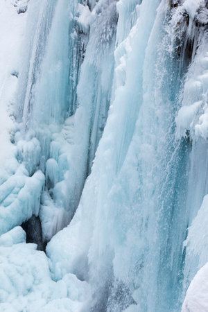 Frozen waterfalls during winter in Plitvice National Park, Croatiaの写真素材