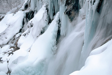 Frozen waterfalls during winter in Plitvice National Park, Croatiaの写真素材