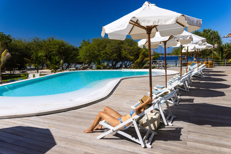 A young woman at the swimming pool in Gili Meno, Indonesiaのeditorial素材